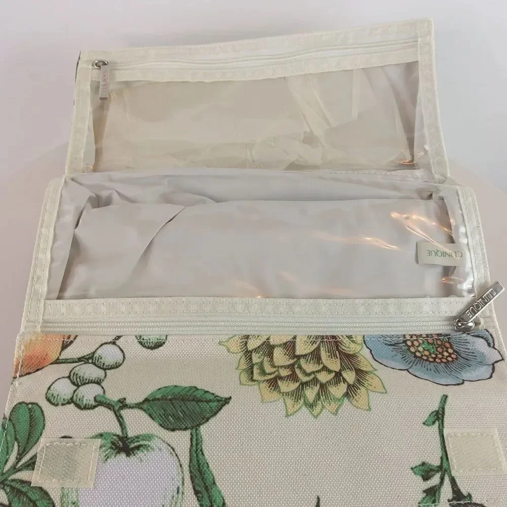 Clinique cream floral print fold over makeup / jewelry bag.